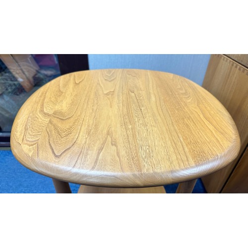 433 - Ercol – an Ercol blonde elm side table, with circular top. Height 65cm, diameter 54cm.