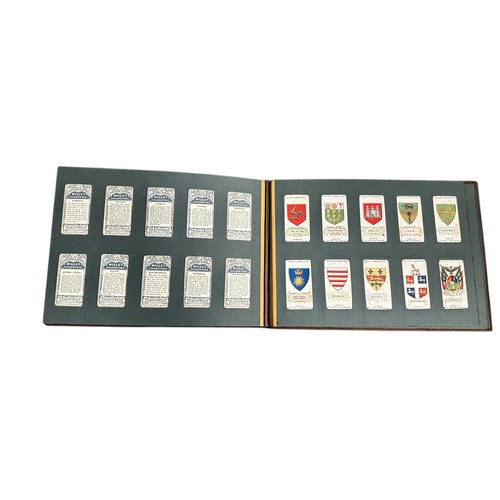 199 - Cigarette card collection in an old slip-in album and loose in a tin with complete and part sets by ... 