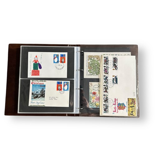 136 - First Day Covers - 1953 to 1970 Xmas, in brown Royal Mail Universal album, nice quality better cover... 