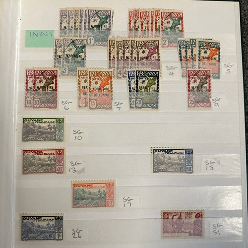 65 - Stamp Stock Book of French Colonies. In green album. Approx 750+ stamps.