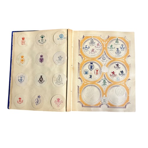 147 - Crests & Monogram Album. Blue album filled with crests and monograms, including wax seals. 1 album.