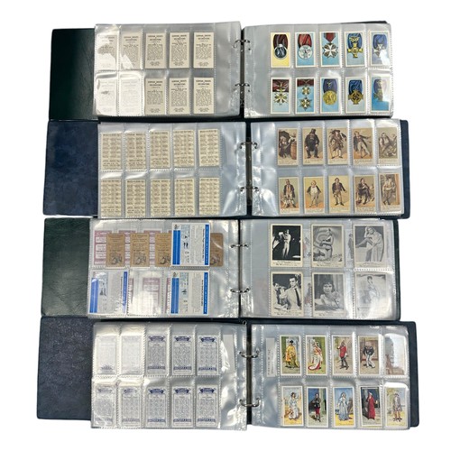 200 - Collection of reproduction cigarette cards and some trade cards in 4 albums, large range of sets in ... 