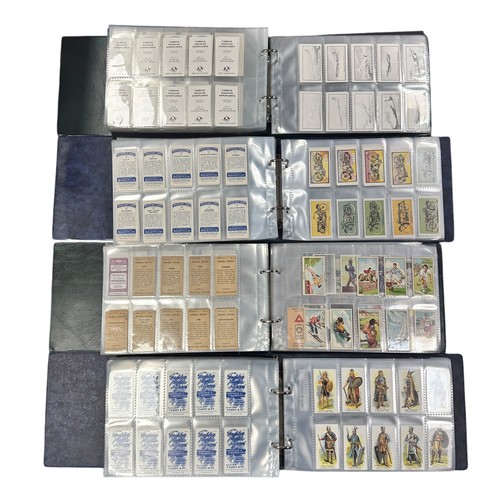 200 - Collection of reproduction cigarette cards and some trade cards in 4 albums, large range of sets in ... 