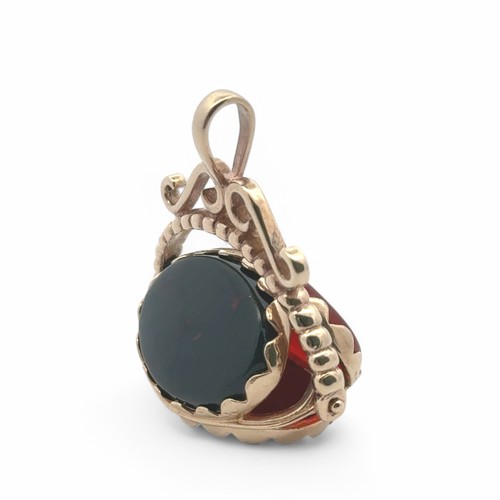 23 - A modern 9ct gold hardstone swivel spinner fob pendant, with bloodstone, carnelian and onyx. 7.52g. ... 