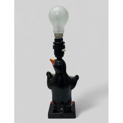 380 - Guinness original Carlton Ware Guinness table lamp, modelled as a standing penguin holding a 'Draugh... 