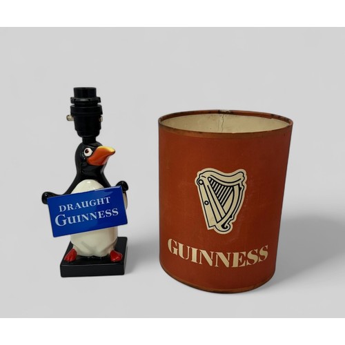 374 - Guinness, Carlton Ware Guinness Penguin Table Lamp modelled as a standing penguin holding a 'Draught... 