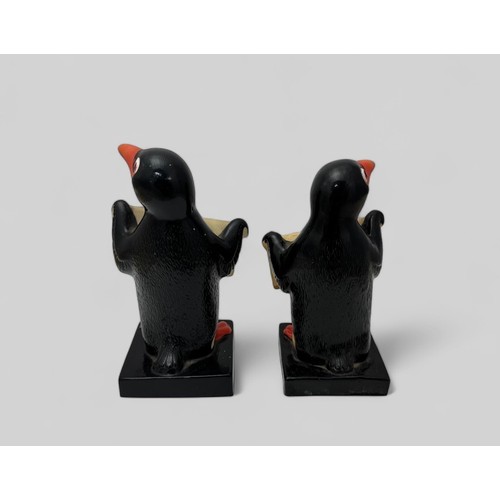 375 - Guinness, pair of Guinness Rubberoid Advertising Penguins. Both holding Draught Guinness signs 17cm ... 