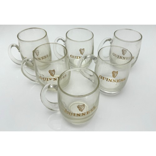 386 - Guinness, box containing six Guinness half pint glass mugs bearing the harp logo with Guinness writt... 