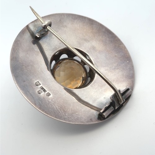 17 - A large Scottish silver and citrine brooch. Hallmarks for Y&T Edinburgh 1907. Length 68mm, citrine 2... 