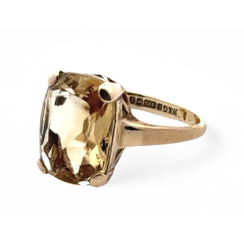 45 - A yellow quartz  9ct gold ring, size M. Weight 3.47g. Stone 18mm x 10mm.