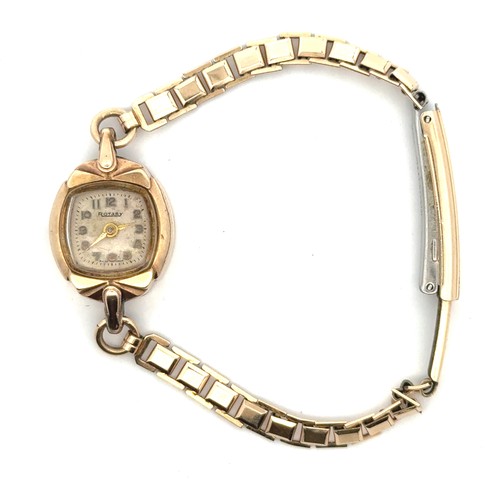 107 - A 9ct gold Rotary ladies gold cocktail watch on a rolled gold bracelet. Weight 11.73g.