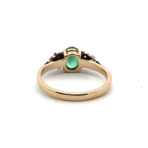 33 - An emerald and diamond ring set in 9ct gold, sponsor S & Co, size P. Weight 2.97g.