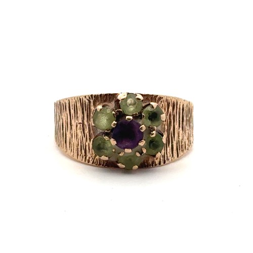 27 - An amethyst and peridot bark effect ring, size R. hallmarked 9ct gold mount, sponsor S & Co.