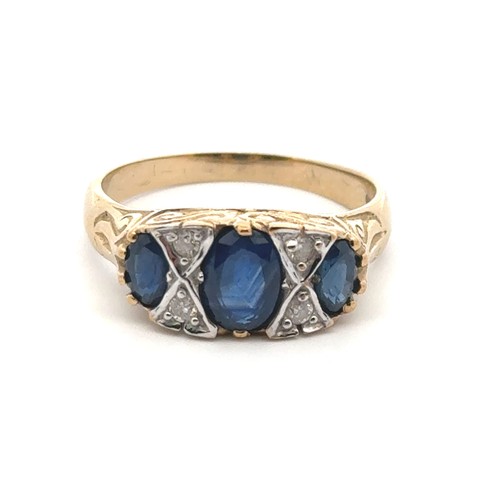 30 - A sapphire and diamond ring set in 9ct yellow gold with a scroll mount. Size Q/R.