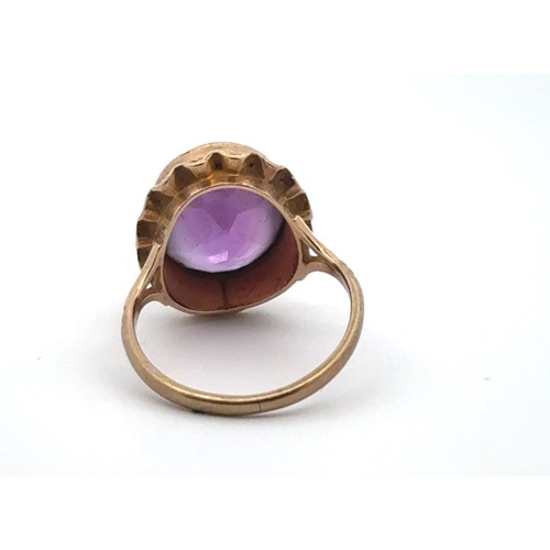 37 - An oval amethyst ring set in 9ct gold, size I. Some wear to amethyst facets. 2.73g