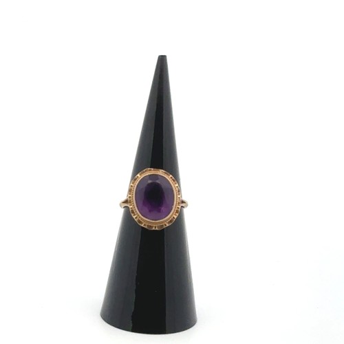 37 - An oval amethyst ring set in 9ct gold, size I. Some wear to amethyst facets. 2.73g