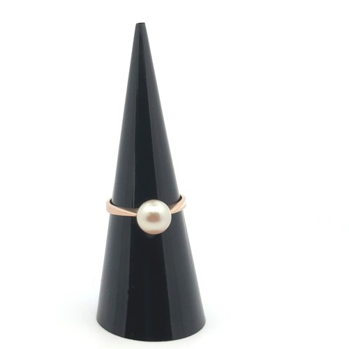 38 - A pearl ring stamped 14k, size K.