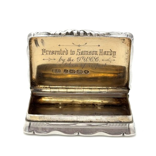 164 - A heavy Victorian silver snuff box with gilt interior by George Unite, Birmingam 1874. Inscribed to ... 