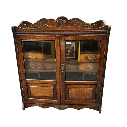 660 - Mahogany Glazed Smokers Cabinet. Compartments with drawers. Some drawers with damaged handles. W55cm... 