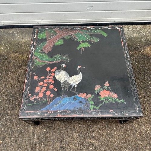 666 - Black Oriental Lacquered Low Table. Decorated with Japanese Cranes with a floral scene. H38cm x W90c... 