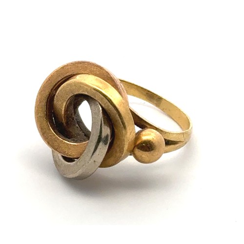 42 - A gold tri-coloured ring designed as three interlocking circles, size M/N, unmarked but tested as ap... 