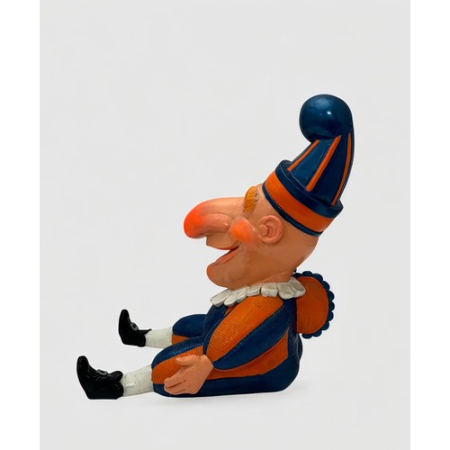 4 - Terry Webster (British, 1941-2024), 
Mr Punch Sitting, 
Composite resin, 
34cm.