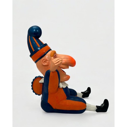 4 - Terry Webster (British, 1941-2024), 
Mr Punch Sitting, 
Composite resin, 
34cm.