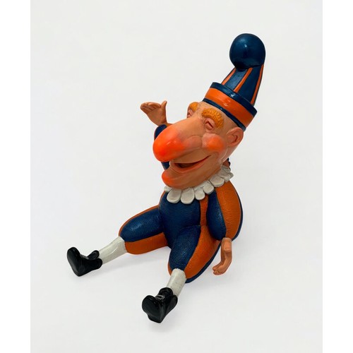 4 - Terry Webster (British, 1941-2024), 
Mr Punch Sitting, 
Composite resin, 
34cm.