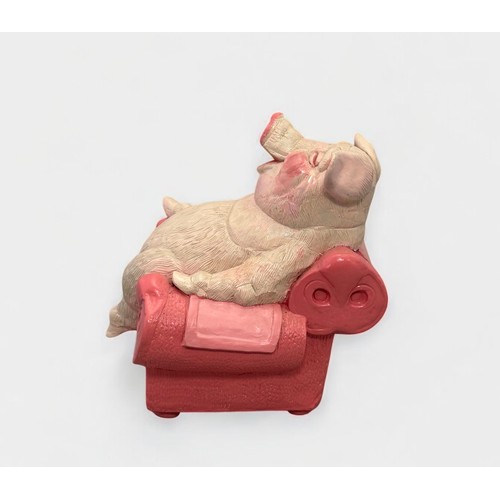 36 - Terry Webster (British, 1941-2024),
Pig on Chair, 
Composite resin, 
19cm.