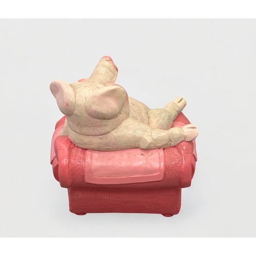 36 - Terry Webster (British, 1941-2024),
Pig on Chair, 
Composite resin, 
19cm.