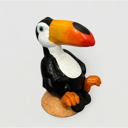 60 - Terry Webster (British, 1941-2024), 
Seated Toucan, 
Composite resin, 
24cm.