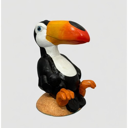 60 - Terry Webster (British, 1941-2024), 
Seated Toucan, 
Composite resin, 
24cm.