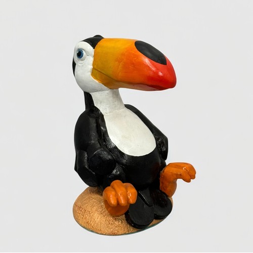 60 - Terry Webster (British, 1941-2024), 
Seated Toucan, 
Composite resin, 
24cm.