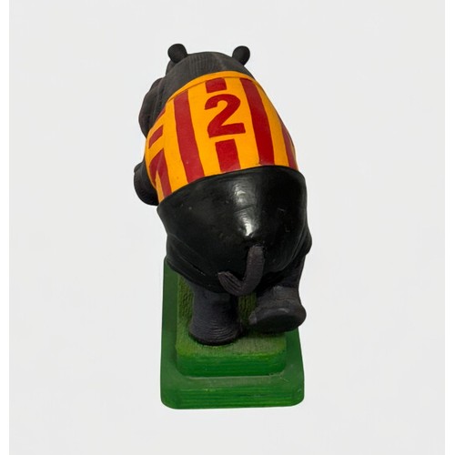 72 - Terry Webster (British, 1941-2024), 
Football Hippo, 
Composite resin on wooden plinth,
21cm.