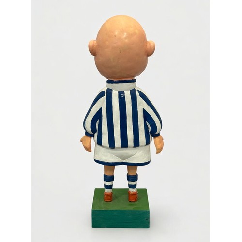 21 - Terry Webster (British, 1941-2024),
Footballer, 
Composite resin on wooden base, 
46cm