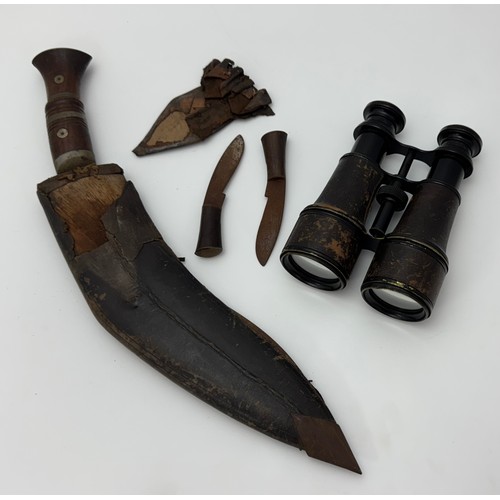 121 - World War II era Kukri with two skinning knives, in scabbard (poor condition). Plus, pair of binocul... 