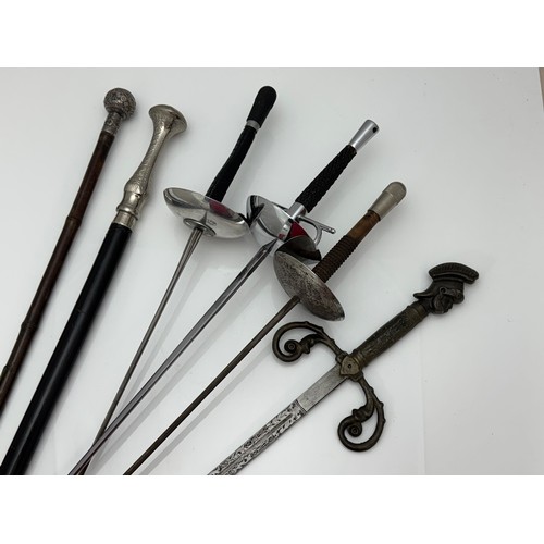 46 - Range of fencing foils and other weaponry, to include a Leon Paul fencing foil, Italian style decora... 