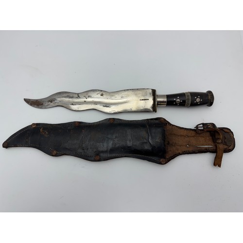 49 - Range of knives to include Indian waved blade dagger in sheath, African carved wooden knife with hea... 