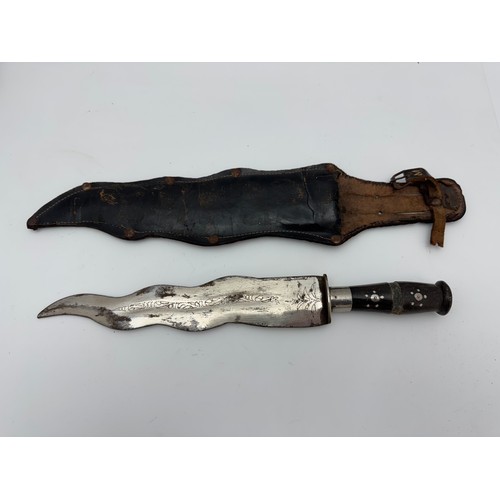 49 - Range of knives to include Indian waved blade dagger in sheath, African carved wooden knife with hea... 