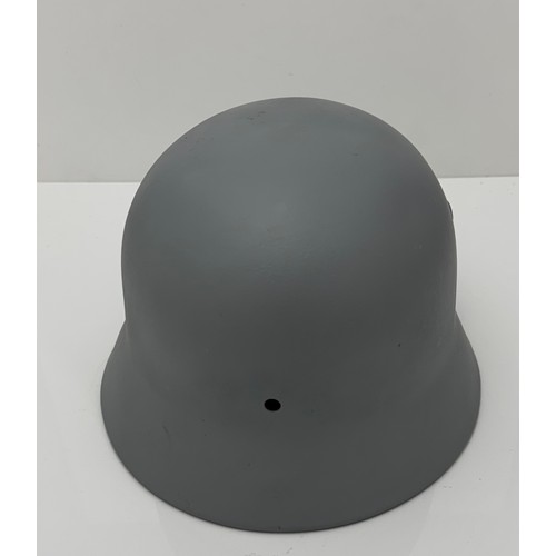 60 - A German WWII helmet M40 Q64. Repainted.