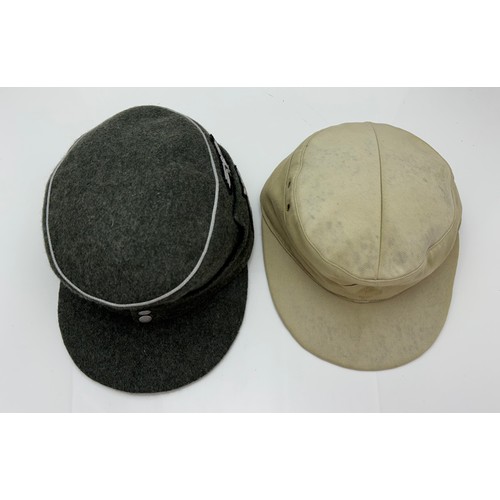 63 - Two reproduction WWII German caps. A reproduction  'SS' M43 field cap with good quality insignia, si... 