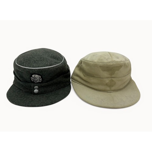 63 - Two reproduction WWII German caps. A reproduction  'SS' M43 field cap with good quality insignia, si... 