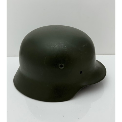 64 - WWII German M35 steel army combat helmet shell.  Marked ET64 to side inner rim and 3001 to back inne... 