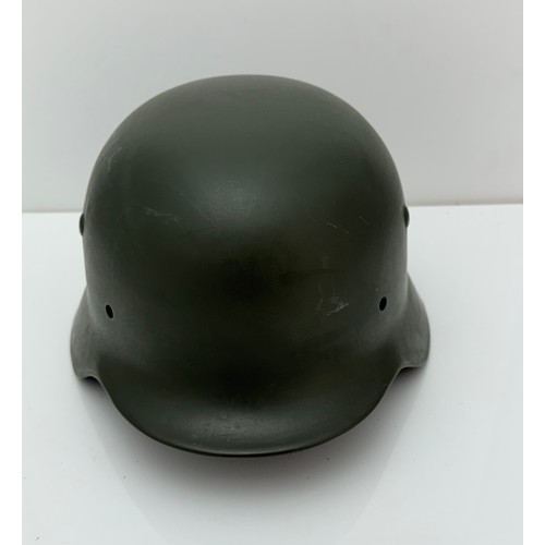 64 - WWII German M35 steel army combat helmet shell.  Marked ET64 to side inner rim and 3001 to back inne... 