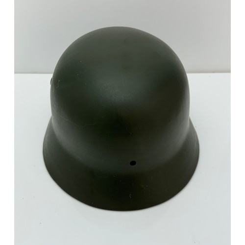 64 - WWII German M35 steel army combat helmet shell.  Marked ET64 to side inner rim and 3001 to back inne... 