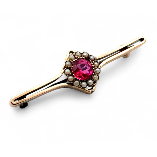 10 - A ruby and pearl cluster bar brooch, approx length 5cm. Base metal pin. Tested as 9ct gold using XRF