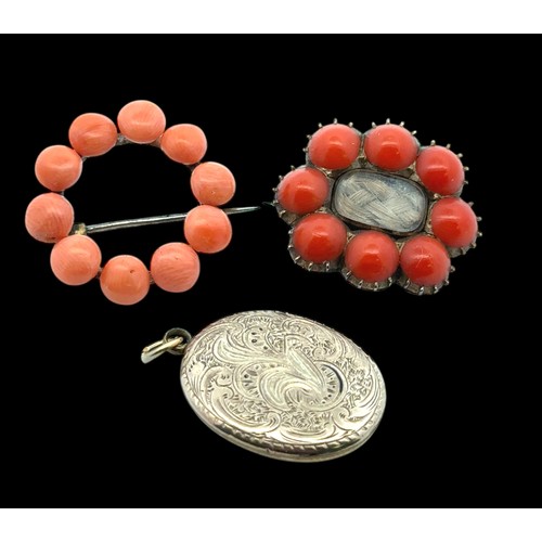 25 - A yellow metal and coral mourning brooch with glazed panel containing woven hair work 28mm wide, a c... 