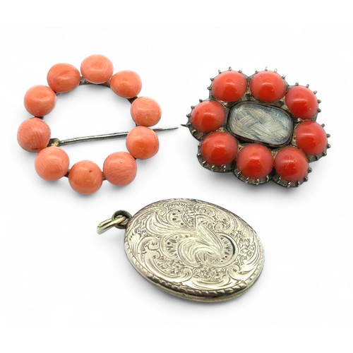 25 - A yellow metal and coral mourning brooch with glazed panel containing woven hair work 28mm wide, a c... 