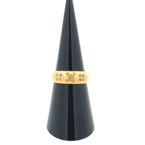 13 - A 22ct gold and diamond gypsy ring, size L.