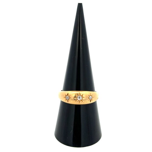 14 - Am 18ct gold and diamond gypsy ring, size P. Birmingham hallmarks.